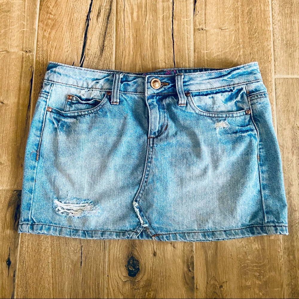 Distressed denim mini skirt